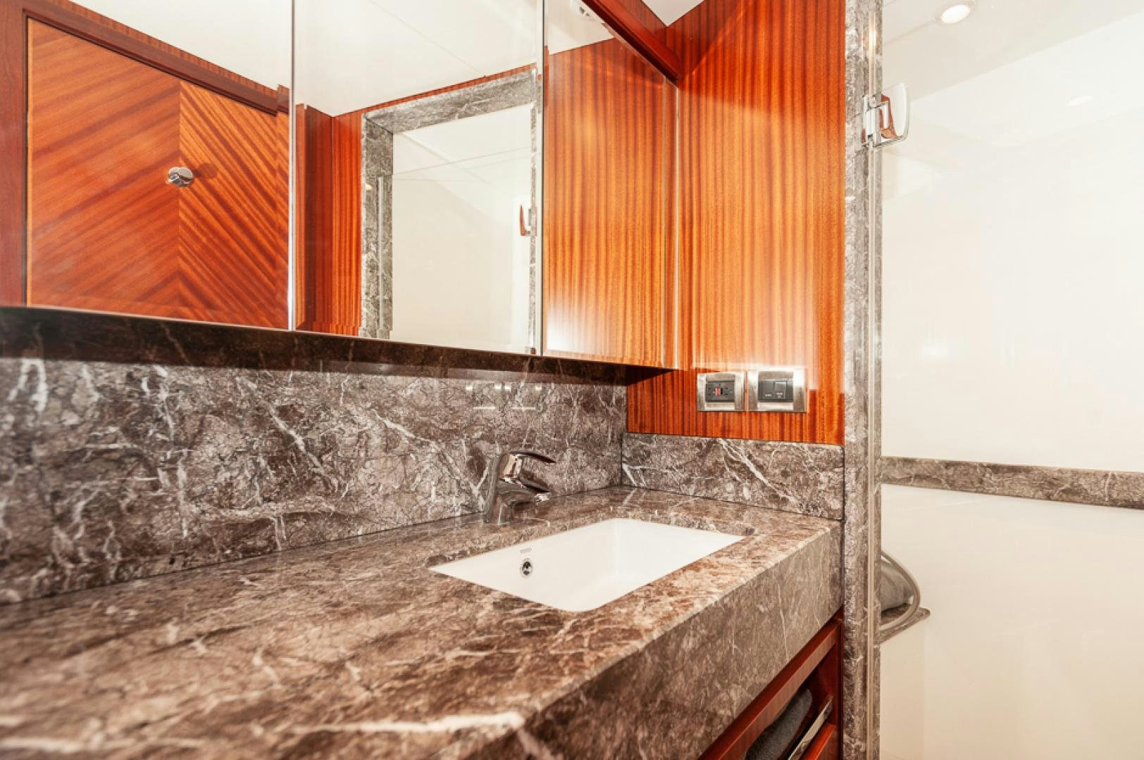 a bathroom with a marble counter top aboard JEANNE SEA QUA Yacht for Sale