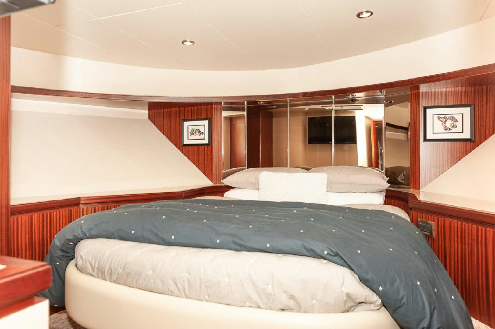 a room with a bed and a desk aboard JEANNE SEA QUA Yacht for Sale