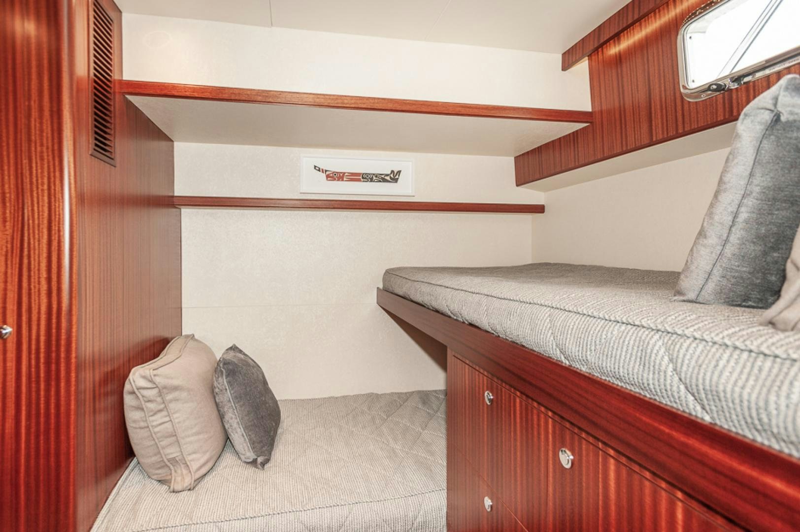 a bedroom with a bed and a couch aboard JEANNE SEA QUA Yacht for Sale