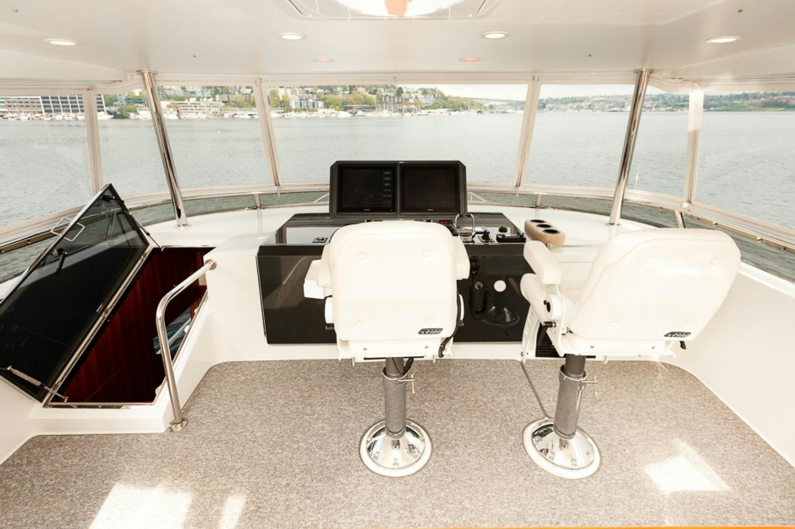 a couple of white chairs next to a black piano and a black piano aboard JEANNE SEA QUA Yacht for Sale