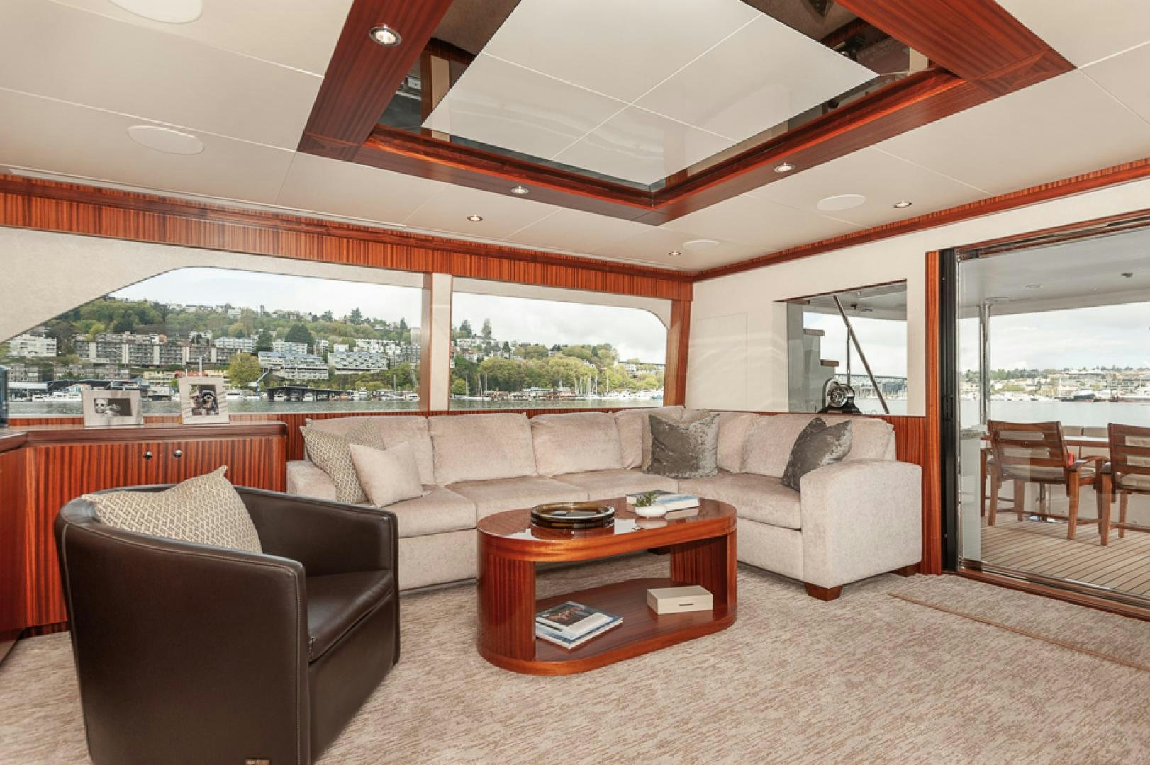 a living room with a couch and a table aboard JEANNE SEA QUA Yacht for Sale