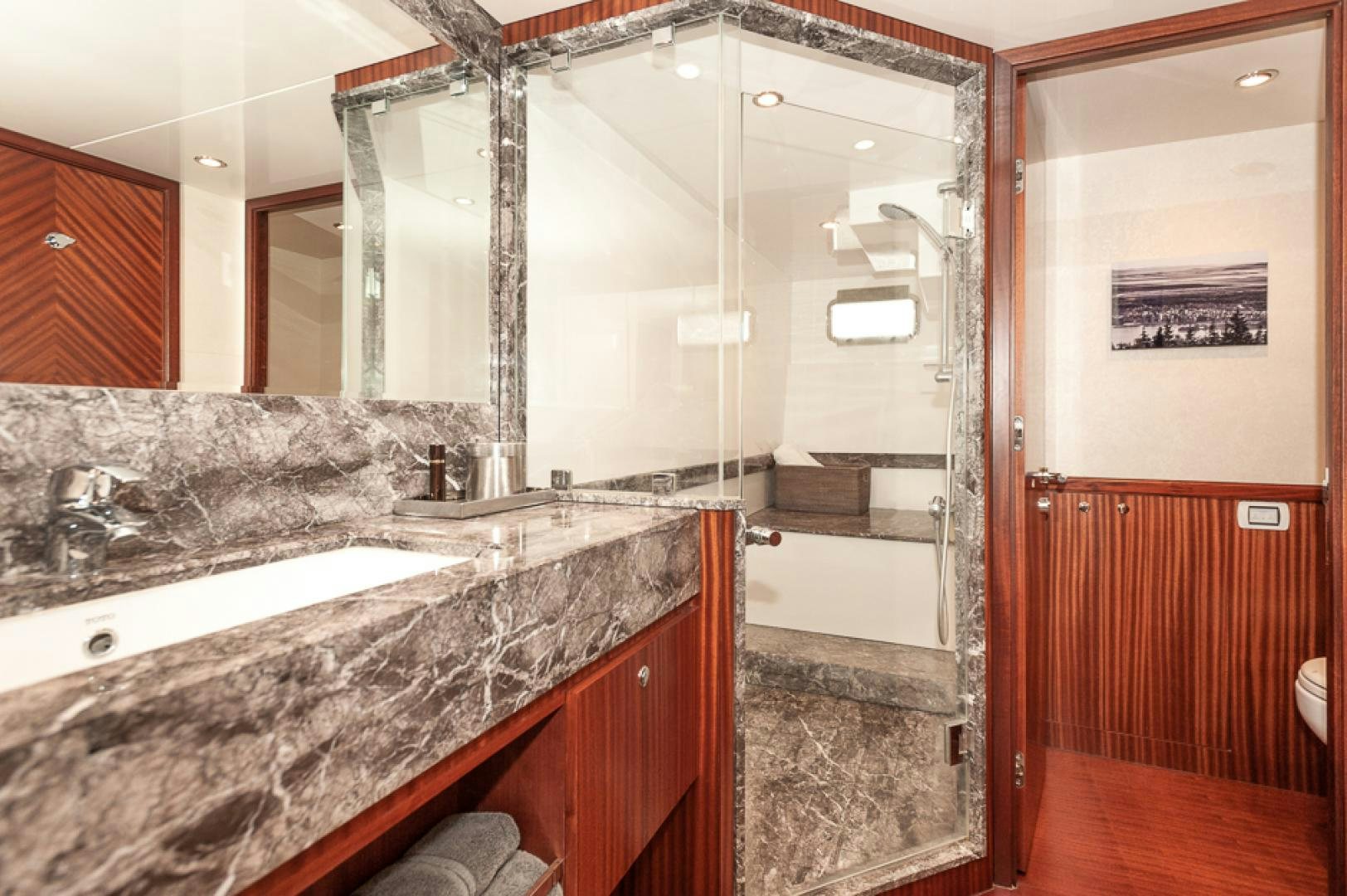 a bathroom with a large mirror aboard JEANNE SEA QUA Yacht for Sale