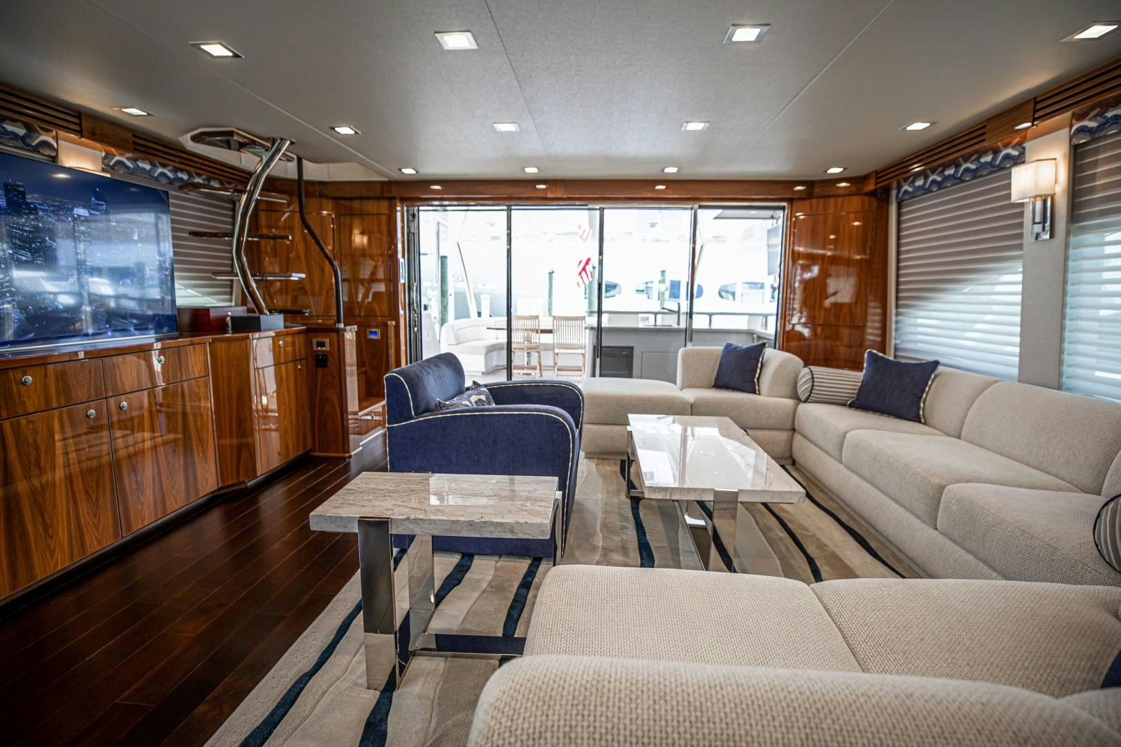 a living room with a large window aboard INDIGO Yacht for Sale