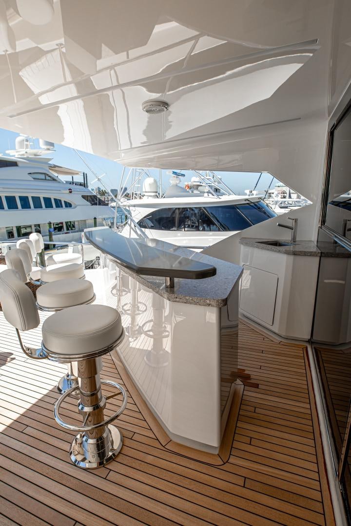 a boat with a table and chairs aboard INDIGO Yacht for Sale