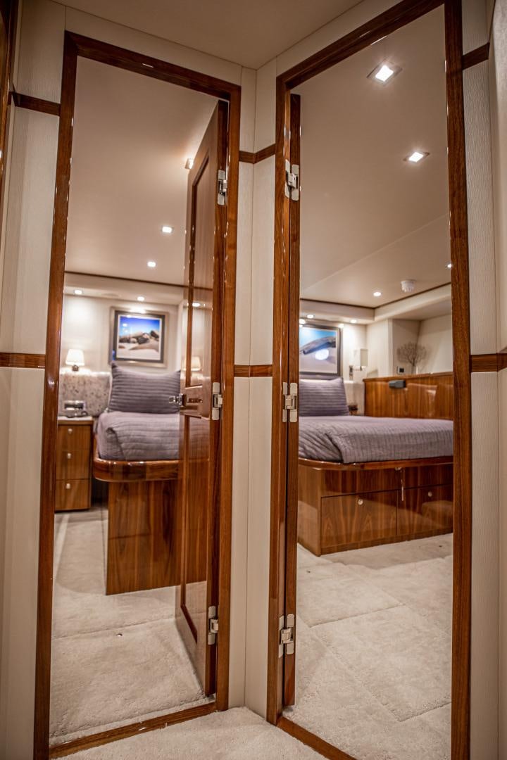 a doorway with a bed and a mirror aboard INDIGO Yacht for Sale