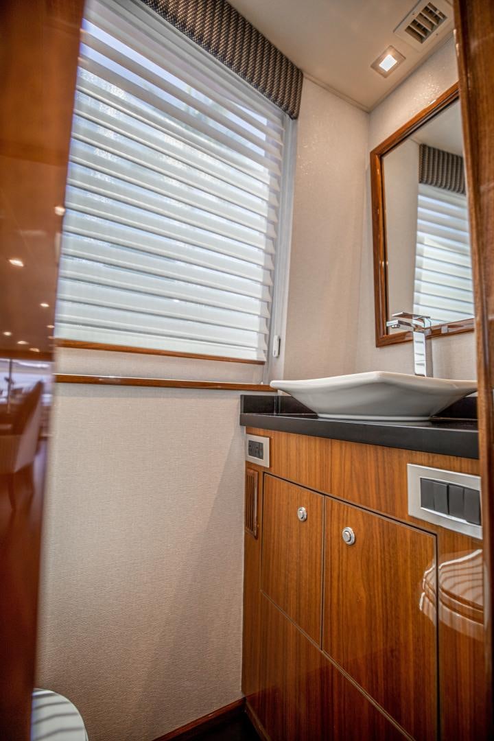 a kitchen with a sink and cabinets aboard INDIGO Yacht for Sale