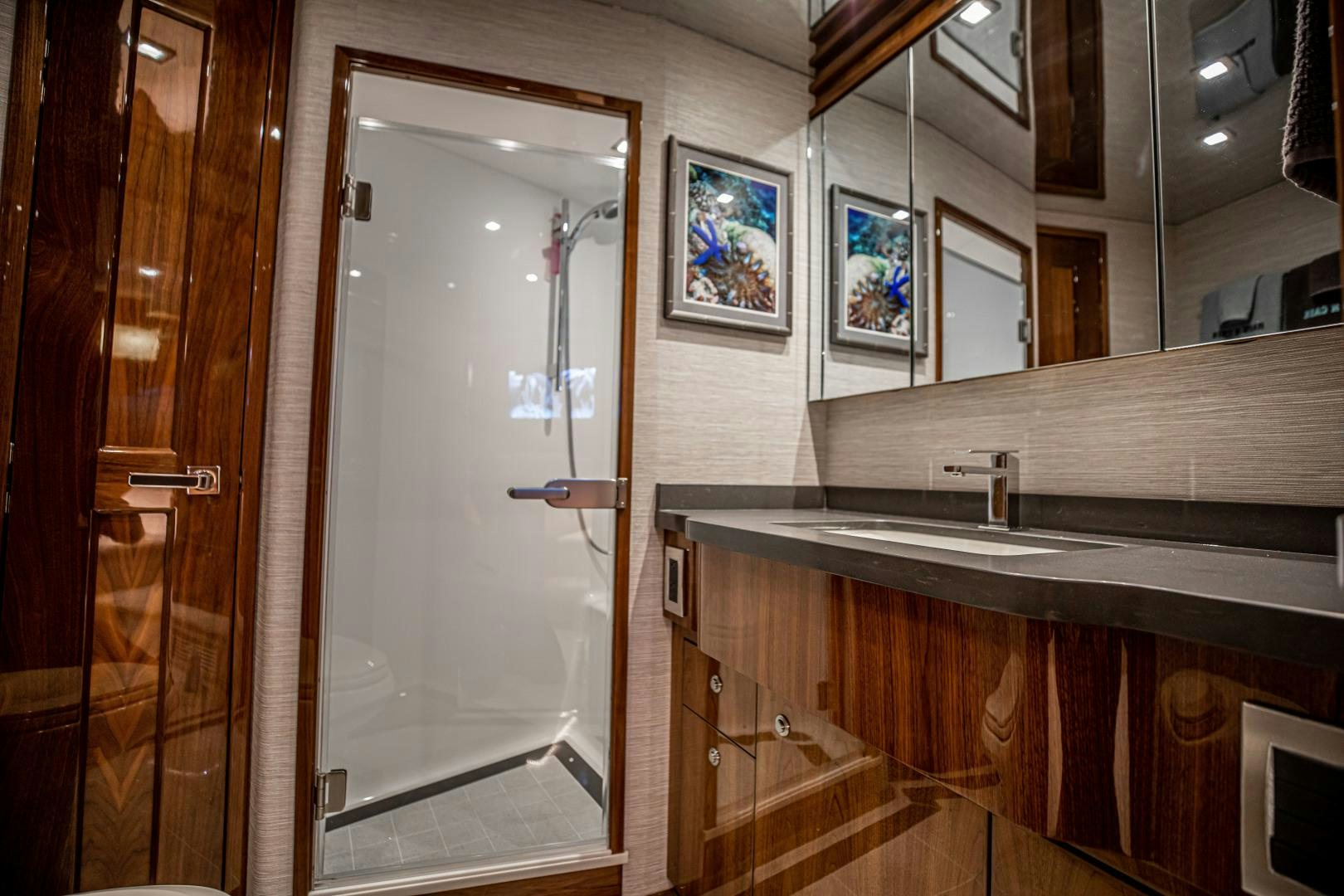 a bathroom with a large mirror aboard INDIGO Yacht for Sale