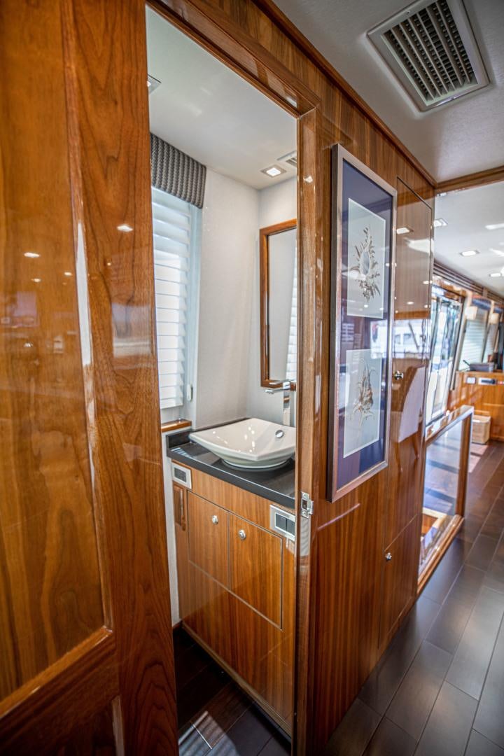 a bathroom with a sink and cabinets aboard INDIGO Yacht for Sale
