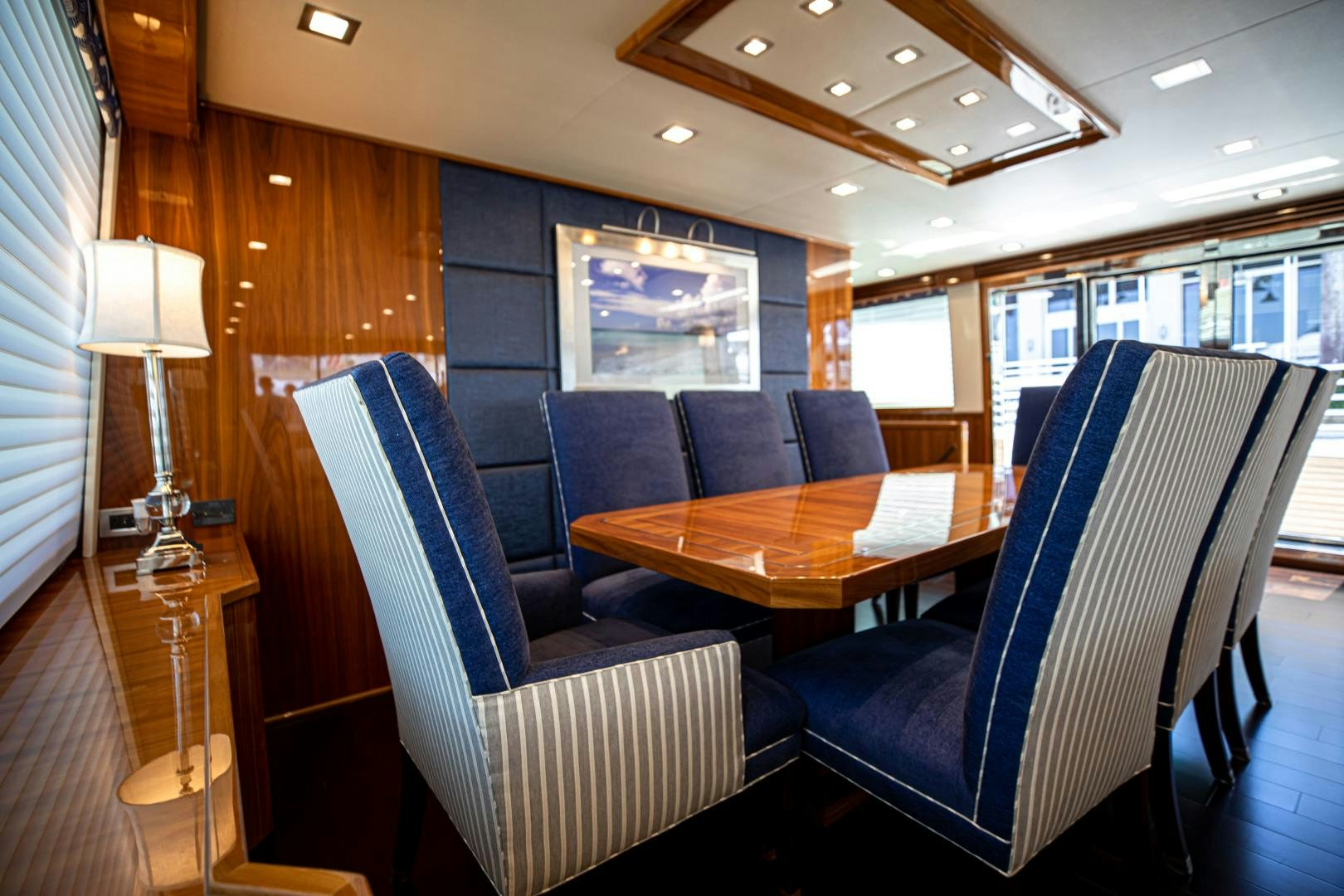 a room with chairs and a table aboard INDIGO Yacht for Sale