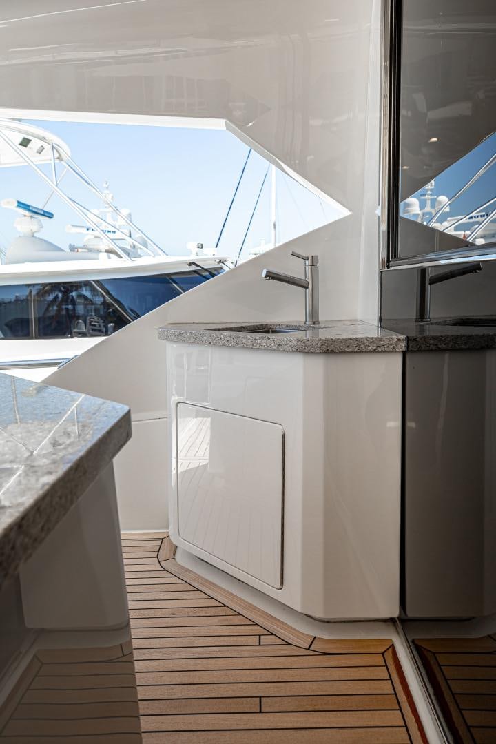 a kitchen with a large window aboard INDIGO Yacht for Sale