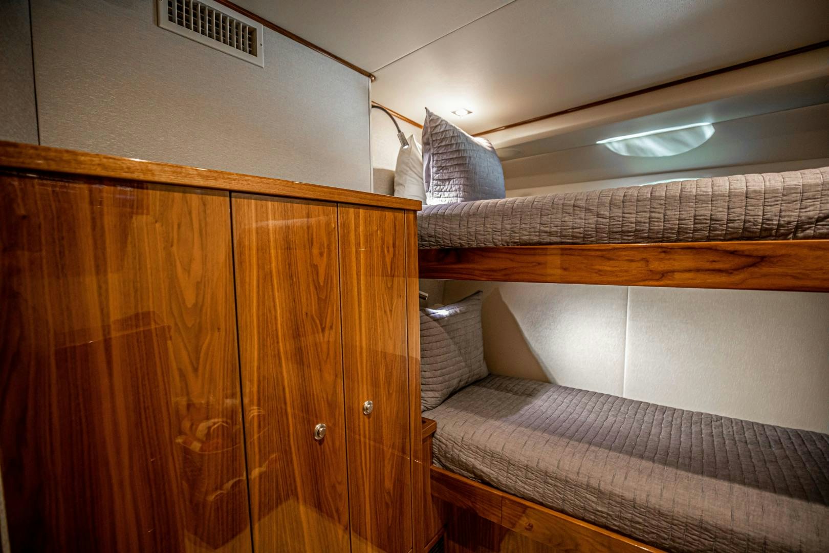 a bed with a couch aboard INDIGO Yacht for Sale