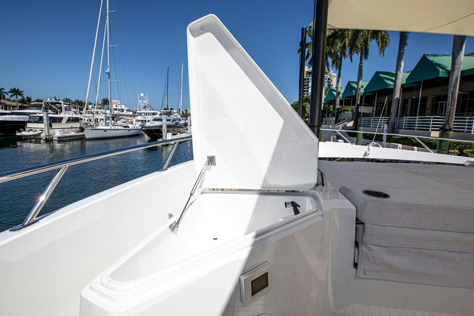 a white boat in a harbor aboard INDIGO Yacht for Sale