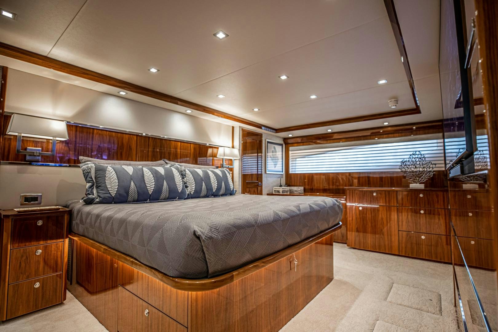a large bed in a room aboard INDIGO Yacht for Sale