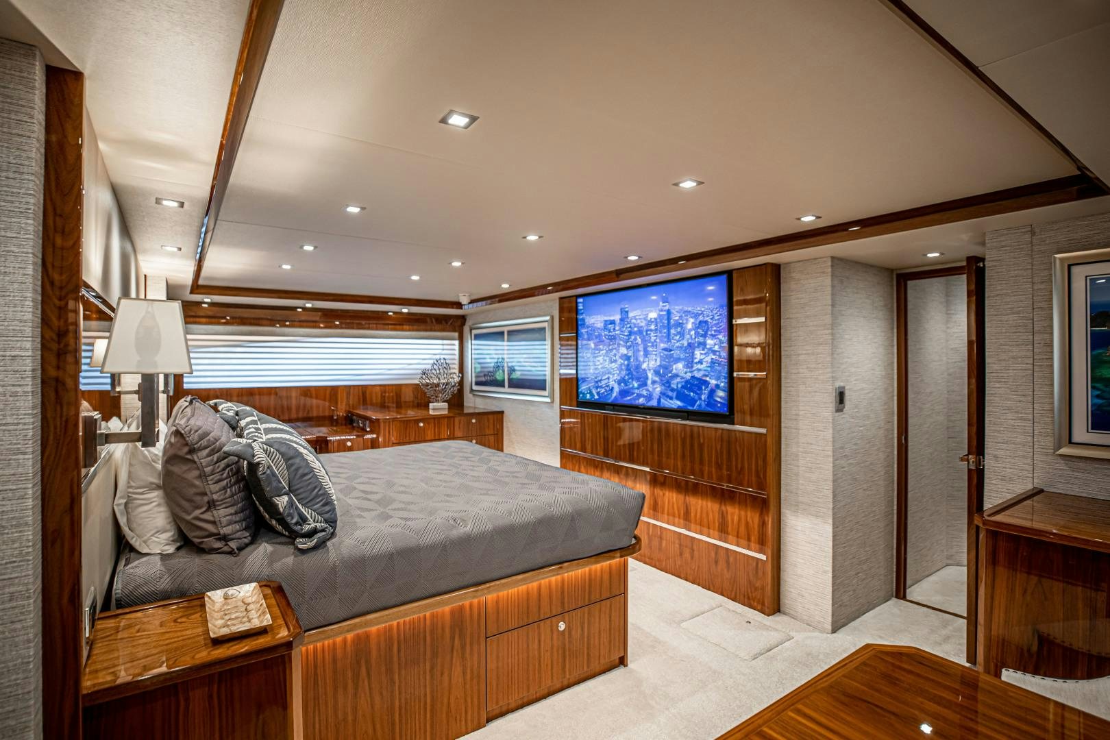 a bedroom with a large bed aboard INDIGO Yacht for Sale