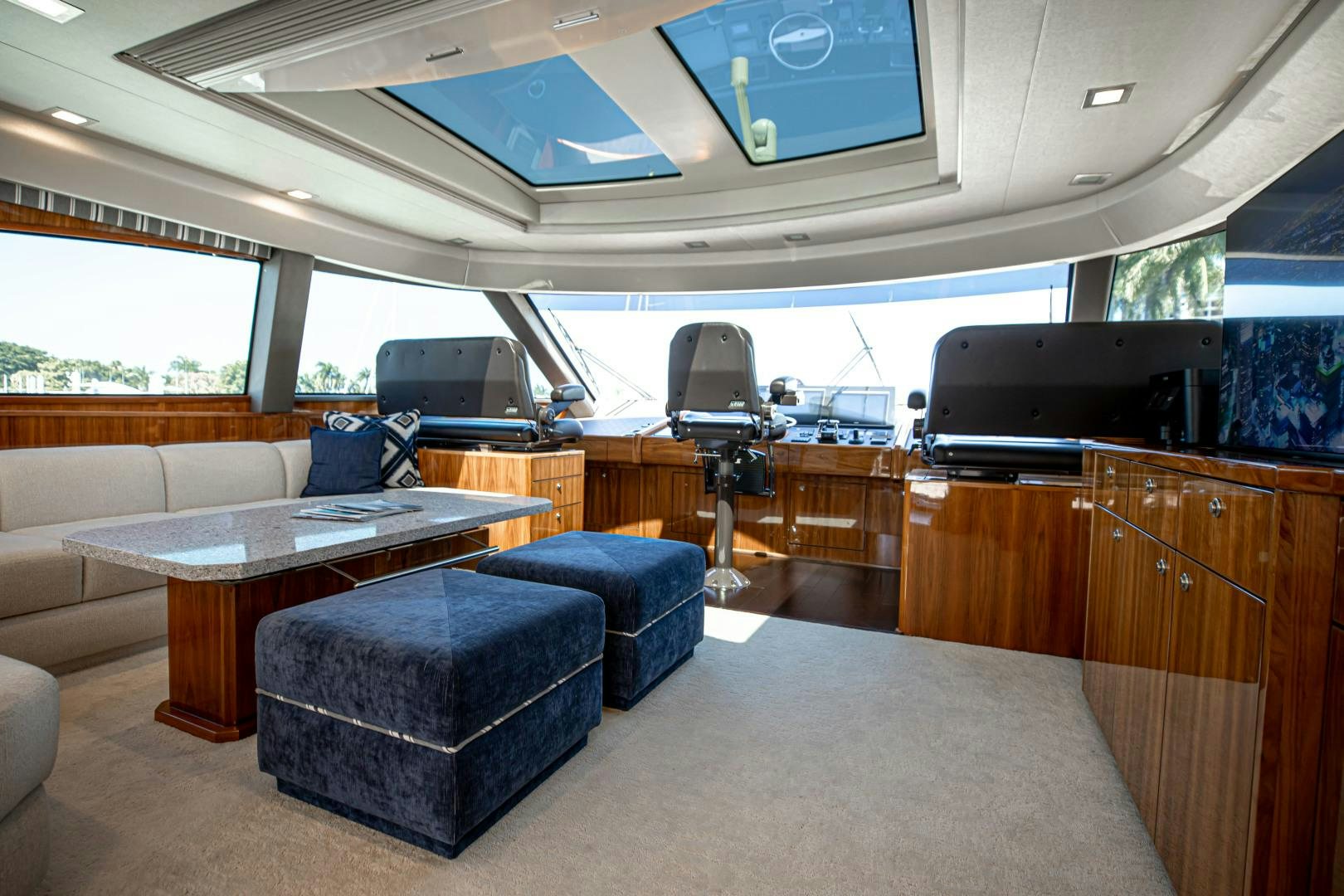 a room with a couch and a table aboard INDIGO Yacht for Sale