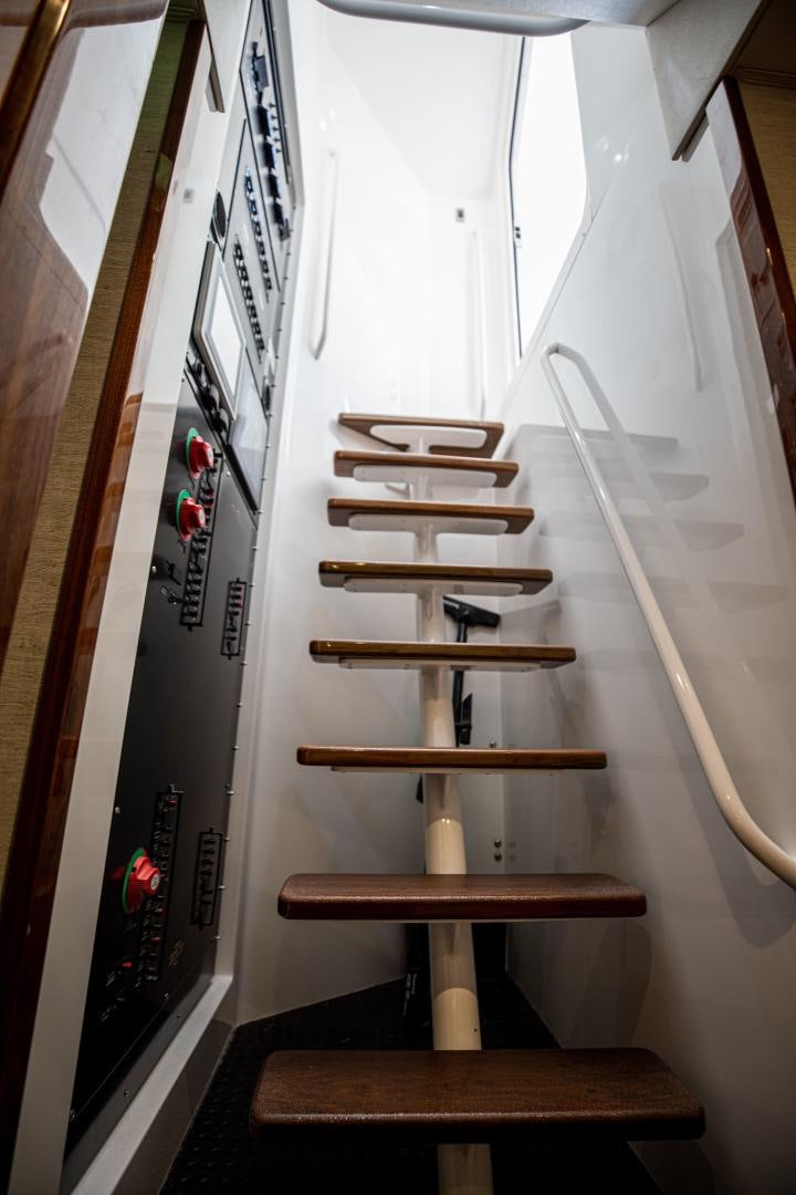 a set of wooden stairs aboard INDIGO Yacht for Sale