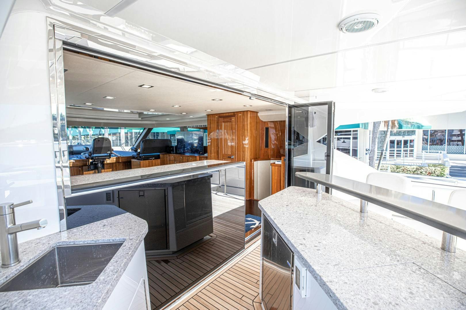 a large kitchen with a large window aboard INDIGO Yacht for Sale