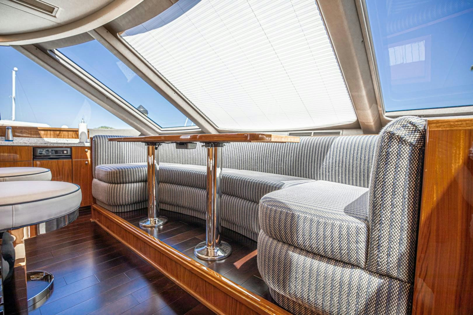 a couch and a chair in a room aboard INDIGO Yacht for Sale