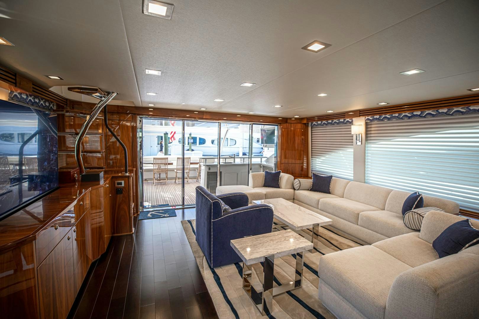 a living room with a large window aboard INDIGO Yacht for Sale