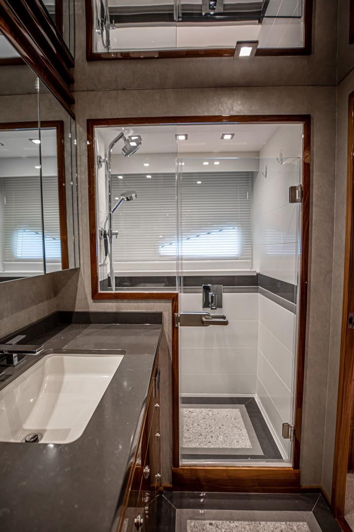a bathroom with a sink and a shower aboard INDIGO Yacht for Sale