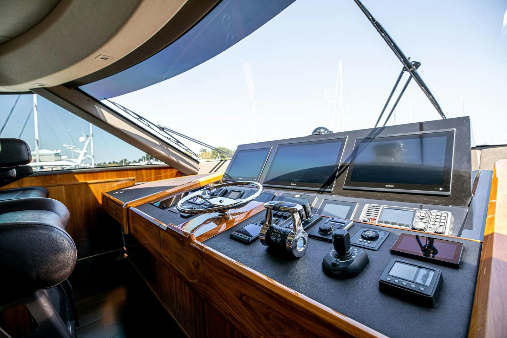 a cockpit with a plane and a desk with a computer on it aboard INDIGO Yacht for Sale