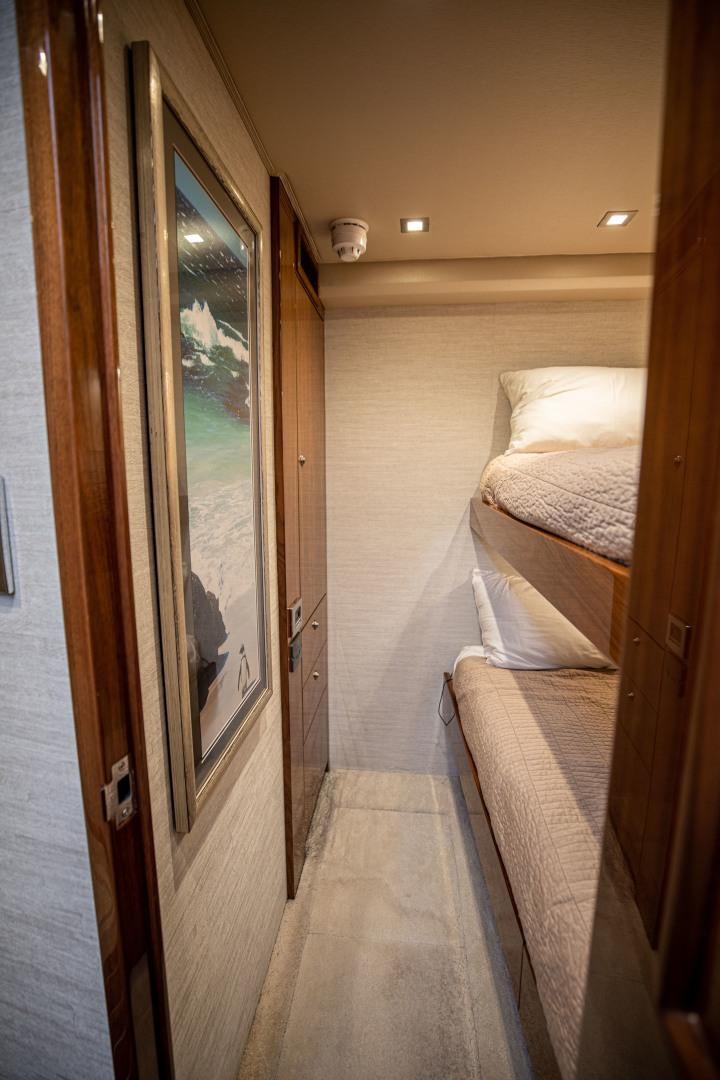 a room with a bed and a door aboard INDIGO Yacht for Sale