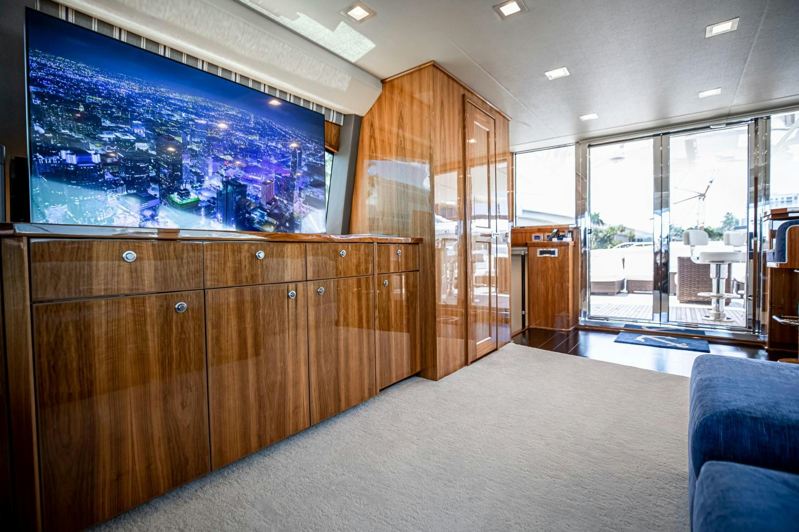 a room with a large wood cabinet aboard INDIGO Yacht for Sale