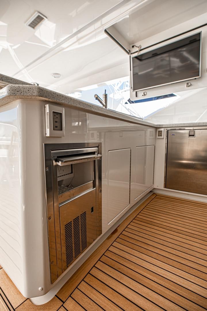 a kitchen with a microwave oven aboard INDIGO Yacht for Sale