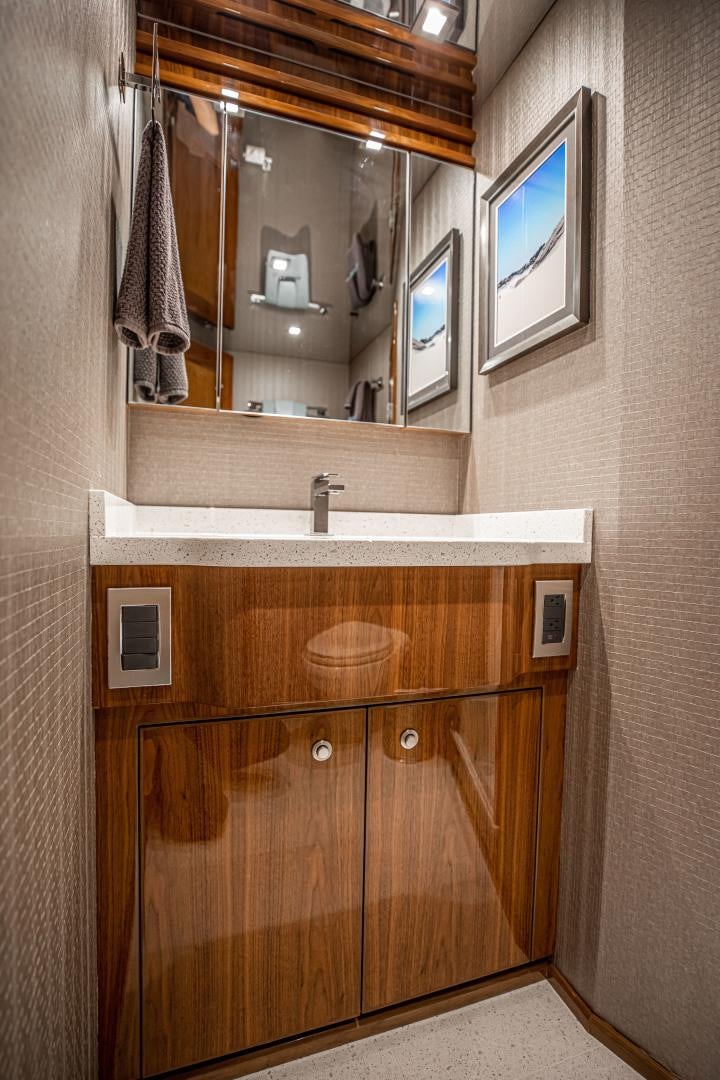 a bathroom with a mirror aboard INDIGO Yacht for Sale