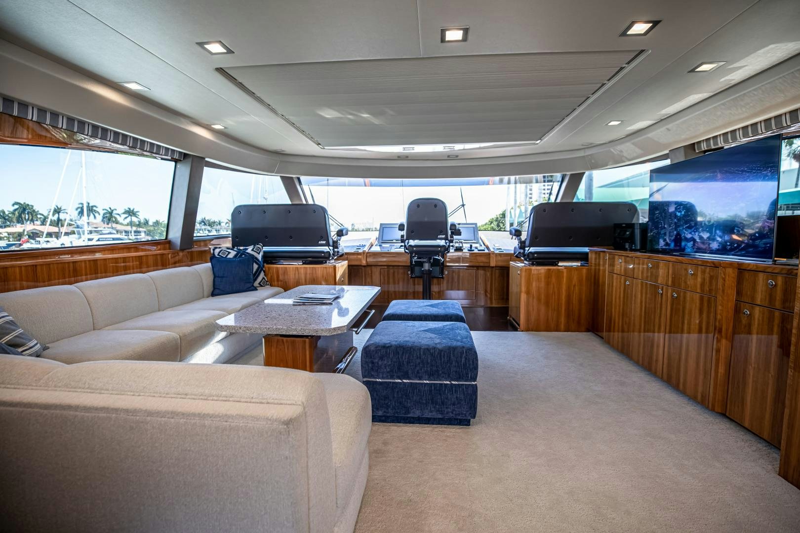 a living room with a couch and a tv aboard INDIGO Yacht for Sale