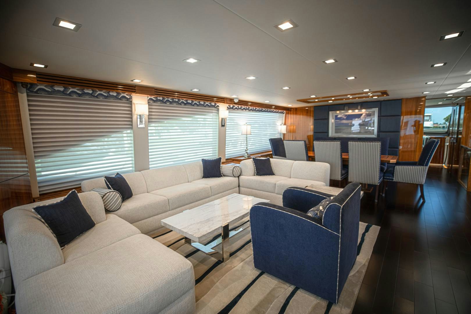 a living room with a large window aboard INDIGO Yacht for Sale