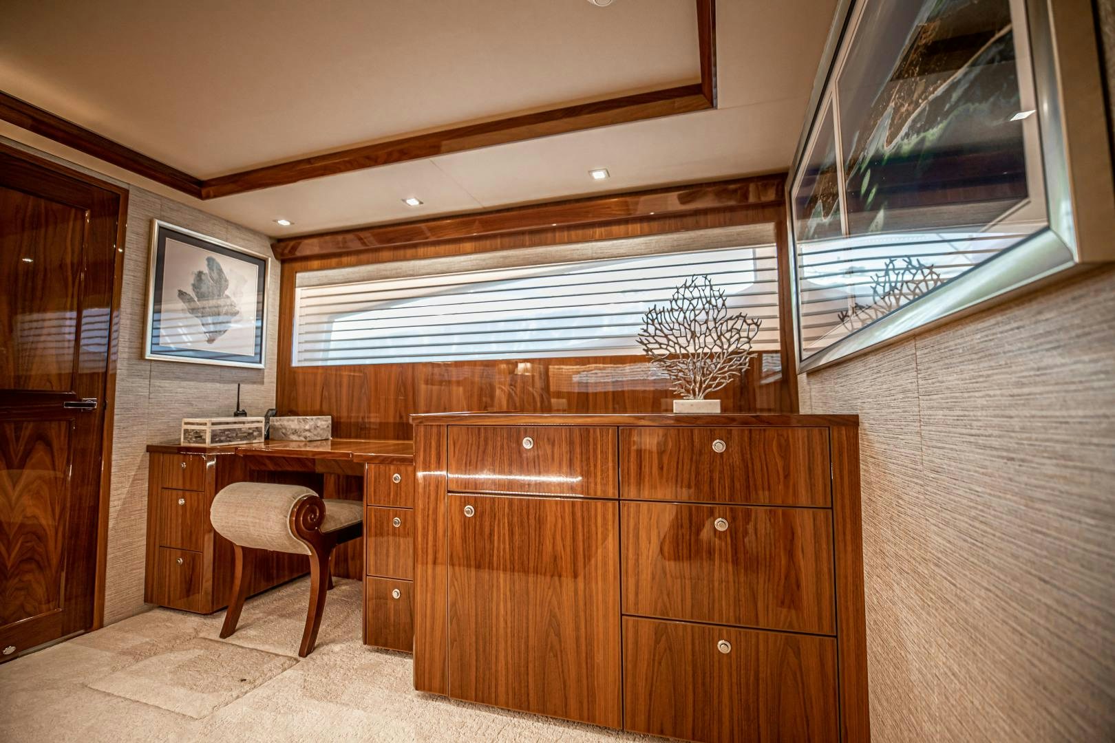 a room with a desk and a chair aboard INDIGO Yacht for Sale