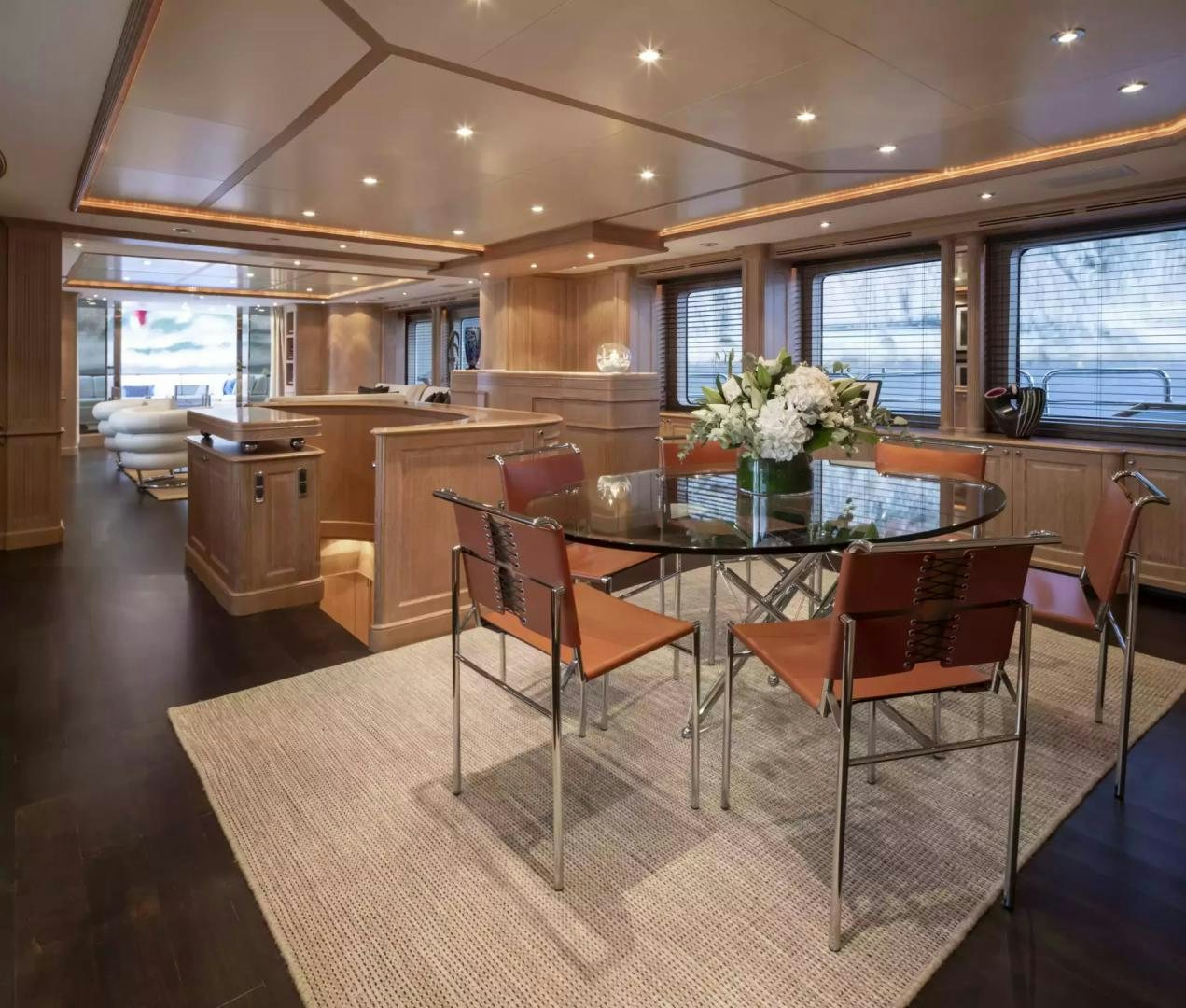 a large kitchen with a table and chairs aboard SOHO Yacht for Sale