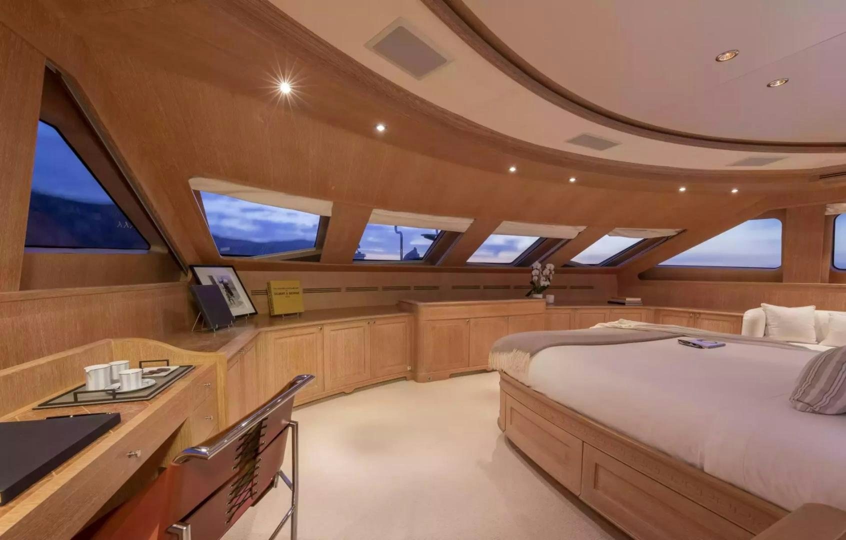 a room with a bed and a desk aboard SOHO Yacht for Sale