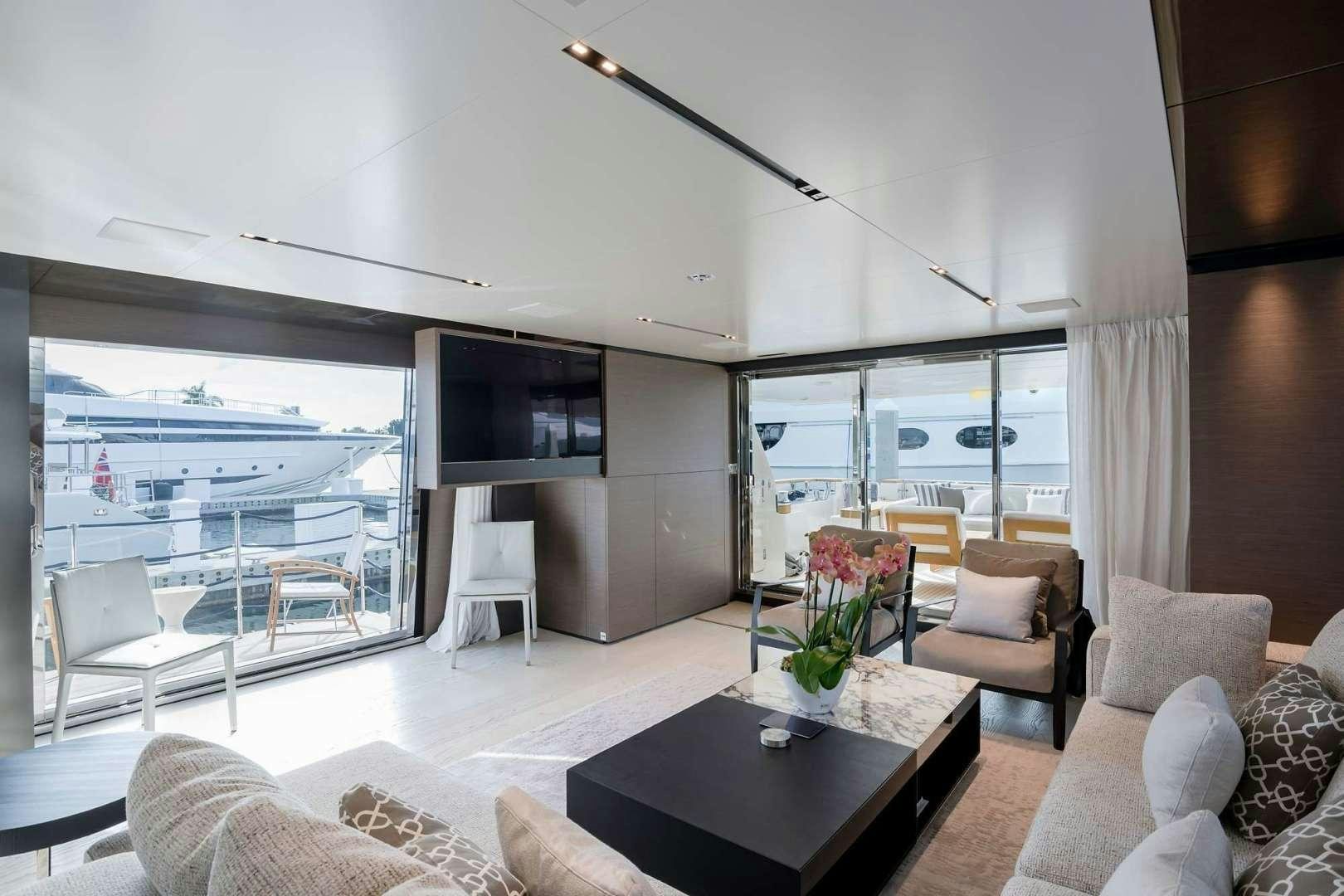 a living room with a large window aboard GIOIA Yacht for Sale