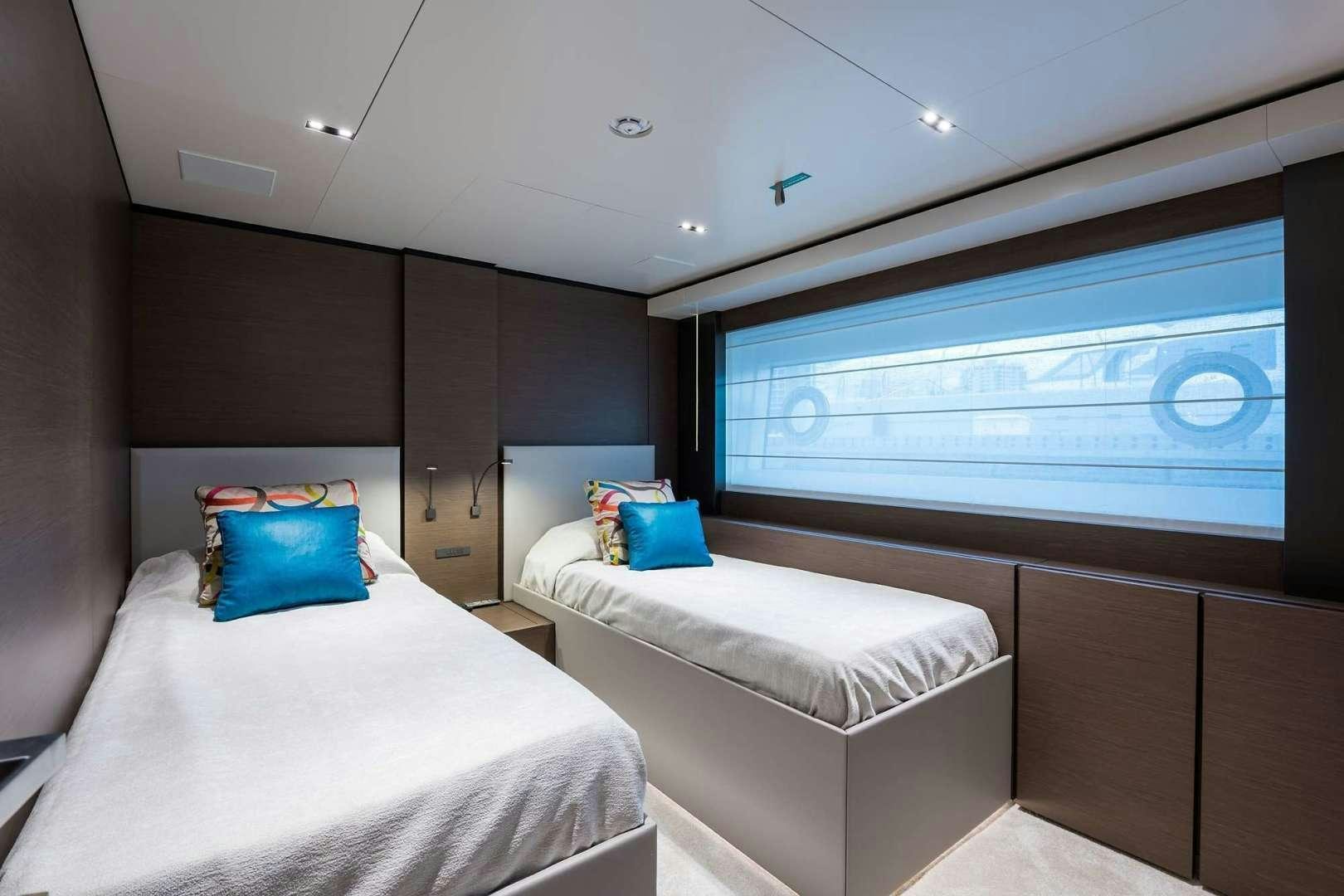 a room with two beds aboard GIOIA Yacht for Sale