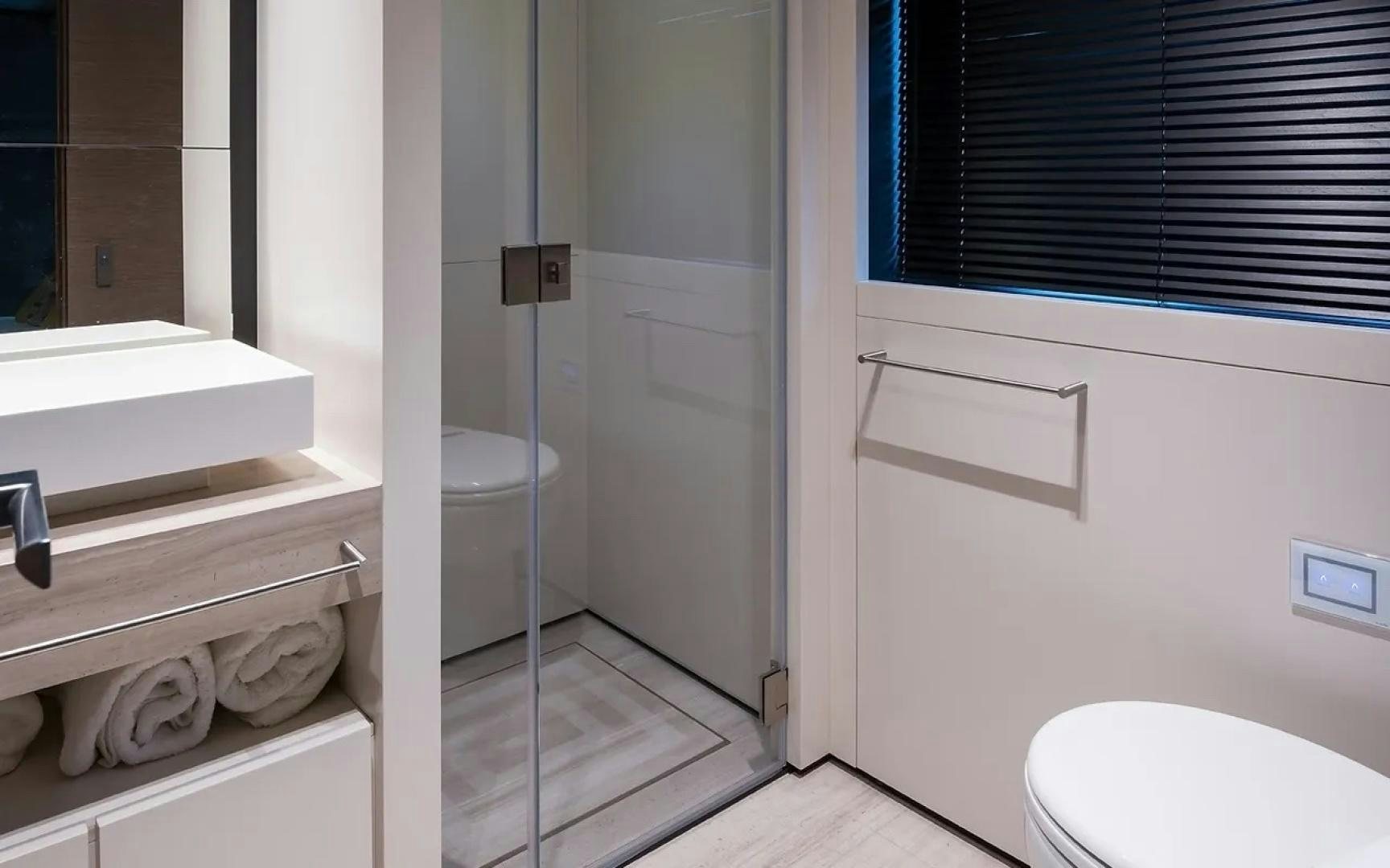 a bathroom with a toilet and a sink aboard GIOIA Yacht for Sale