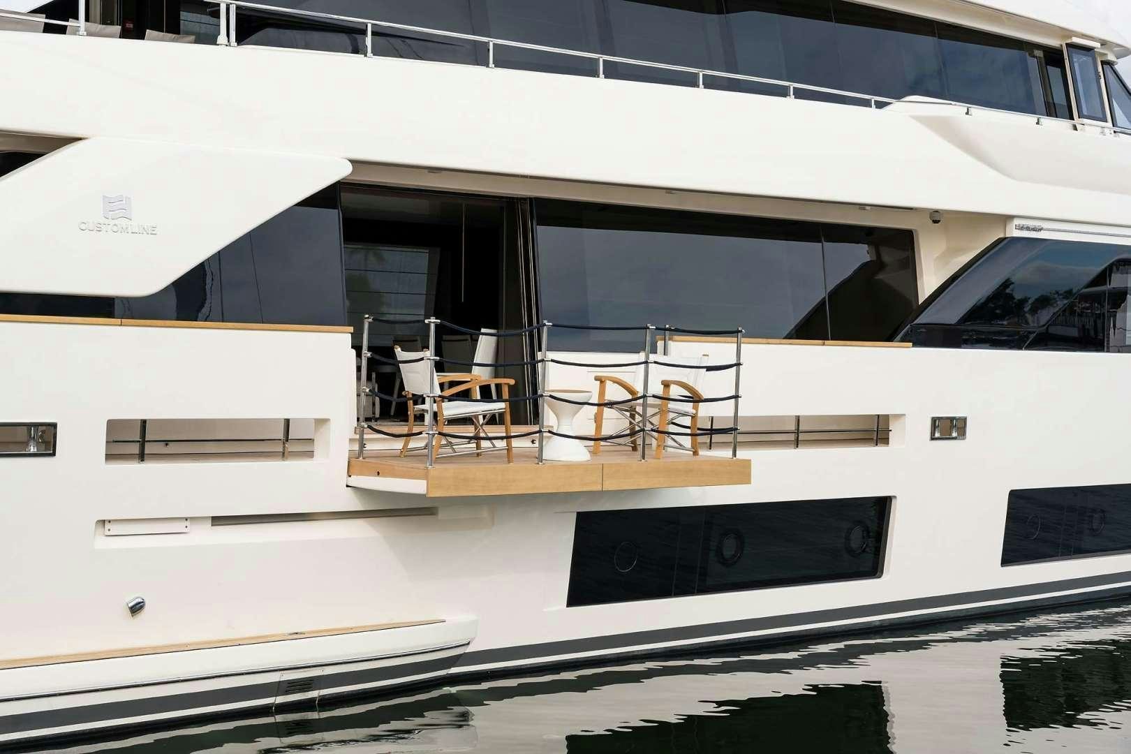 a white building with a black sign on the front aboard GIOIA Yacht for Sale