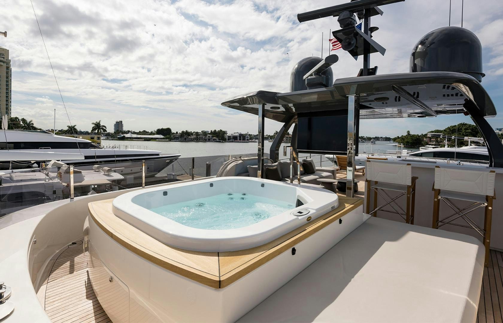 a large pool with a large round pool in it aboard GIOIA Yacht for Sale