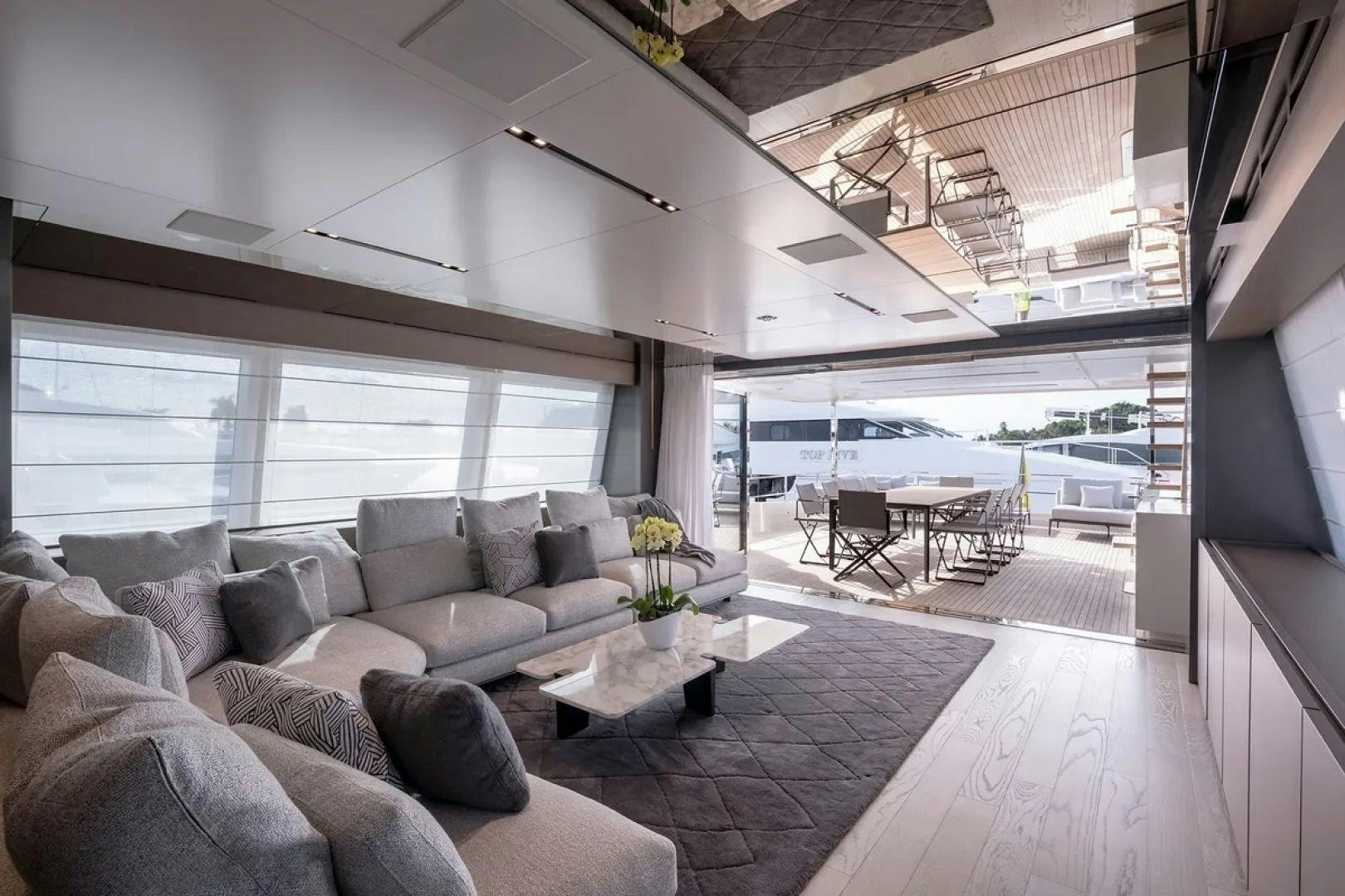 a living room with a large window aboard GIOIA Yacht for Sale