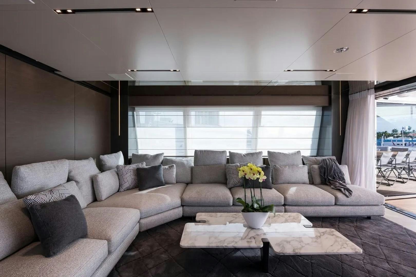 a living room with a couch and a table aboard GIOIA Yacht for Sale