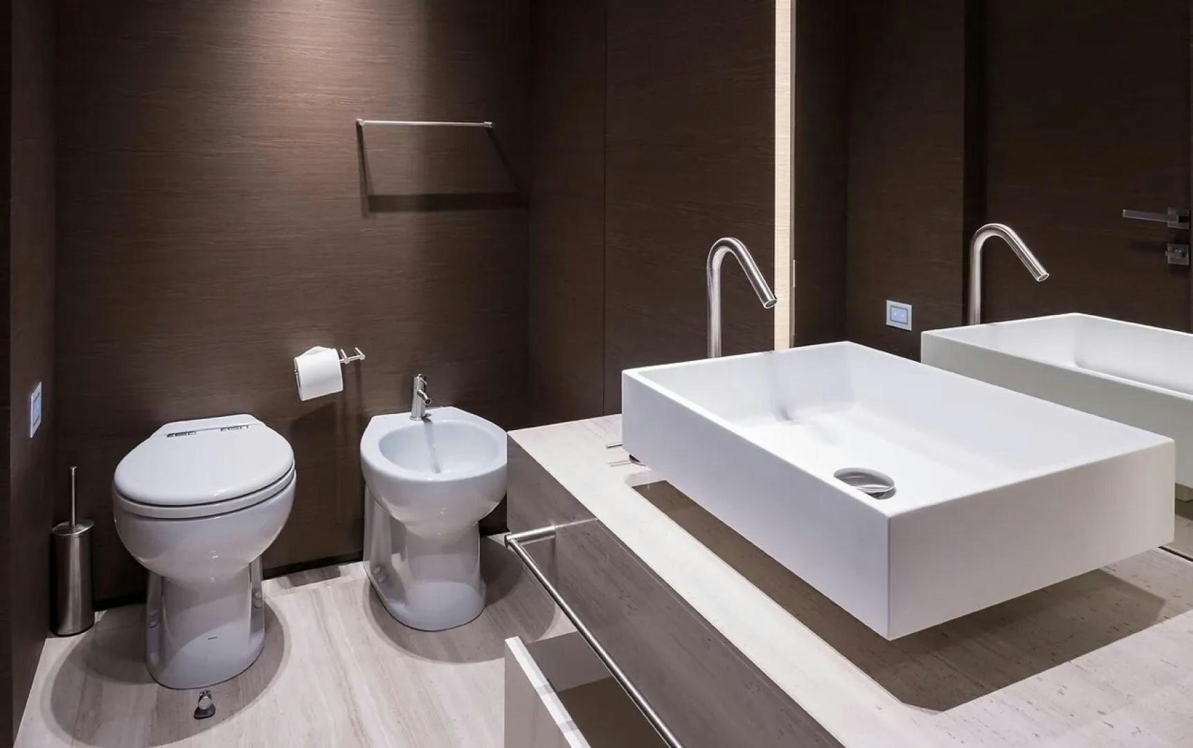a bathroom with a tub sink and toilet aboard GIOIA Yacht for Sale