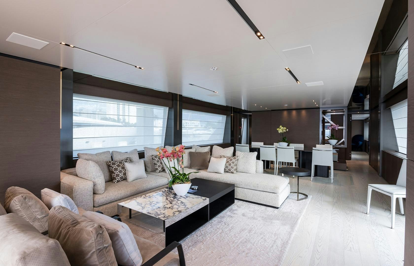 a living room with a large window aboard GIOIA Yacht for Sale