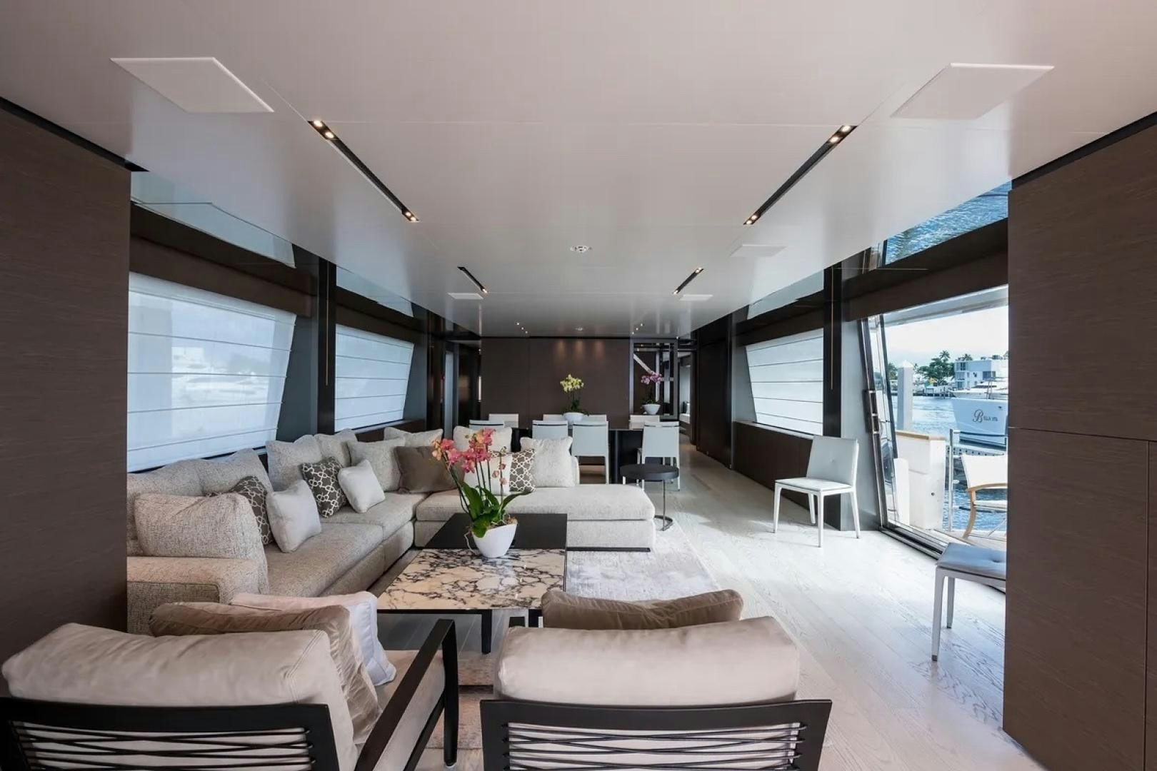 a living room with a large window aboard GIOIA Yacht for Sale