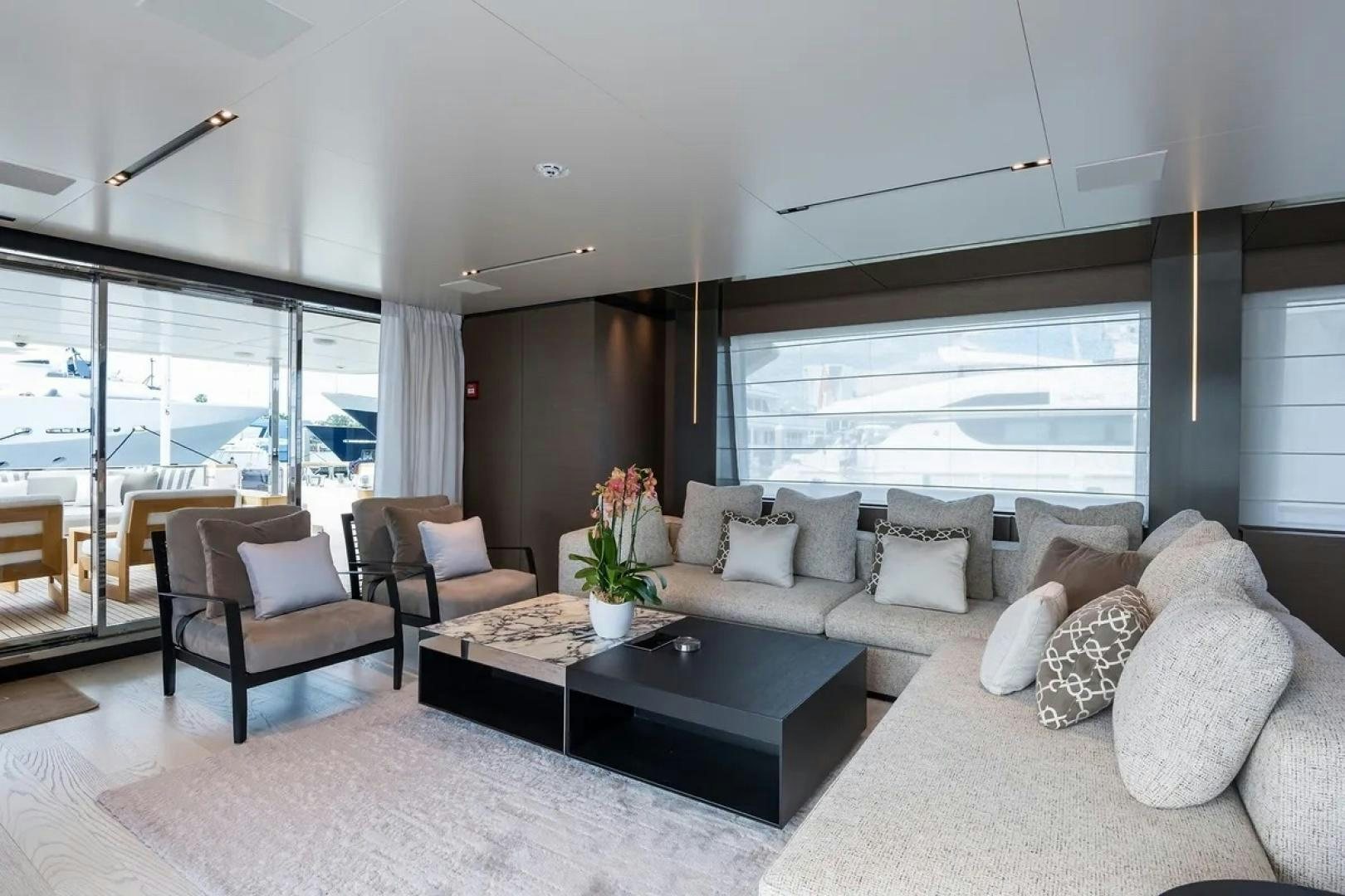 a living room with a large window aboard GIOIA Yacht for Sale