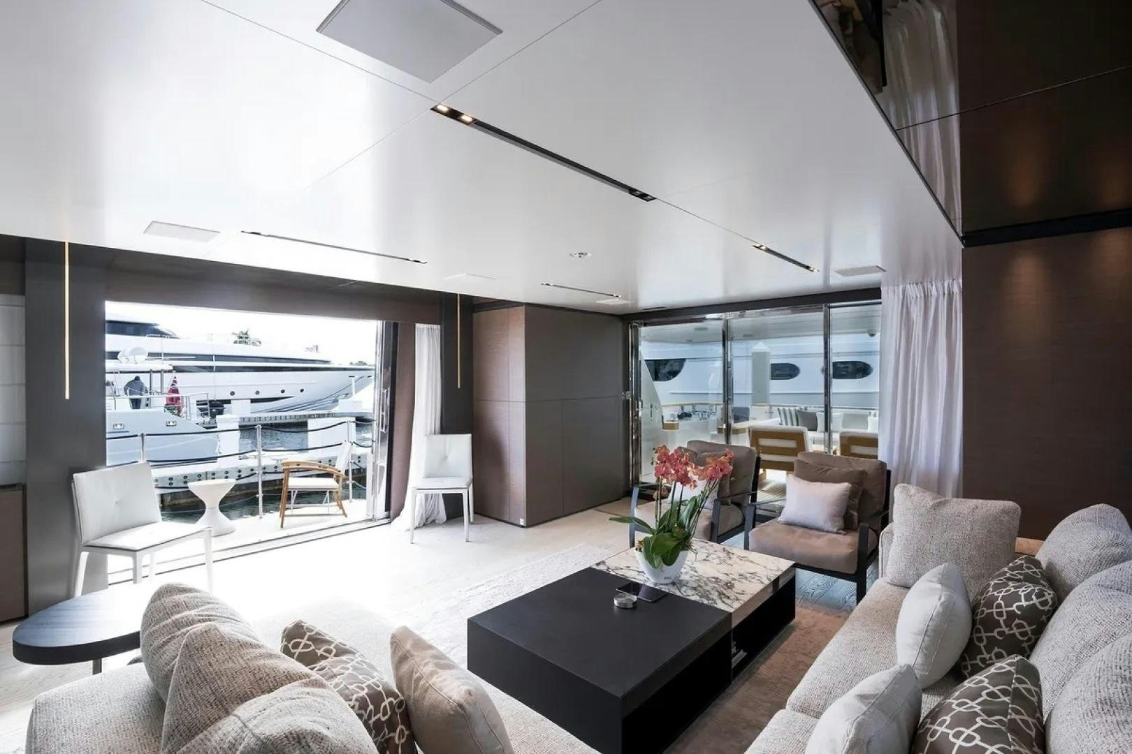 a living room with a large window aboard GIOIA Yacht for Sale