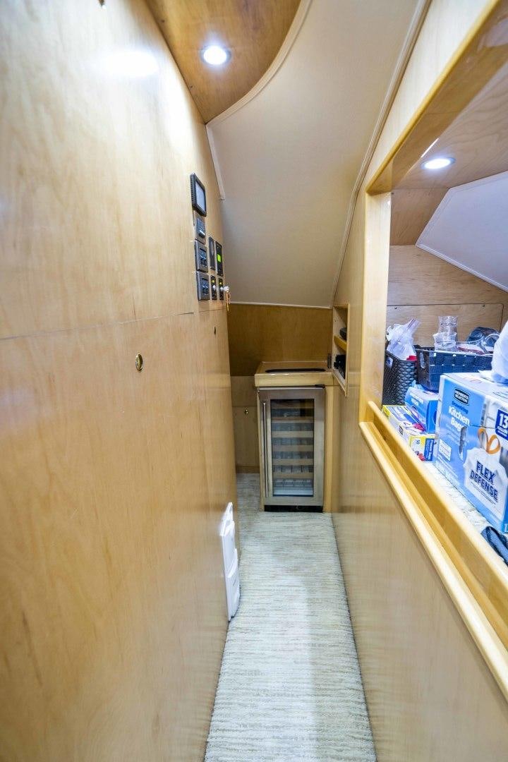 a hallway with a door and a hallway with a tile floor aboard LAST CALL Yacht for Sale