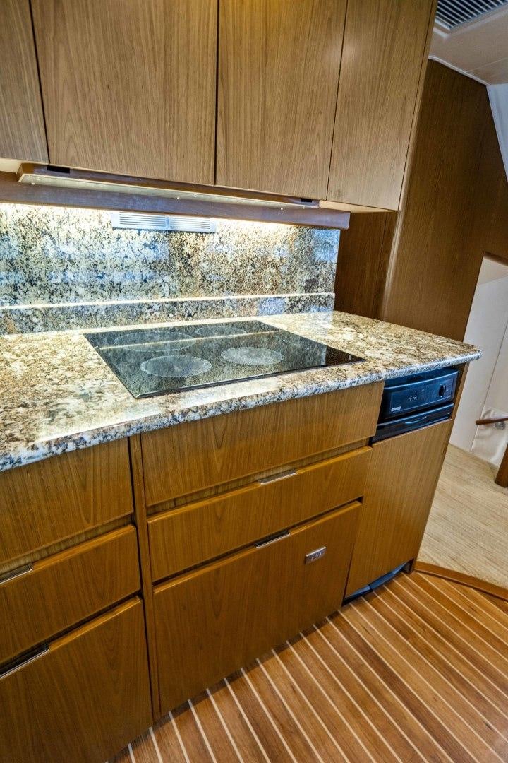 a kitchen with a large marble counter top aboard LAST CALL Yacht for Sale