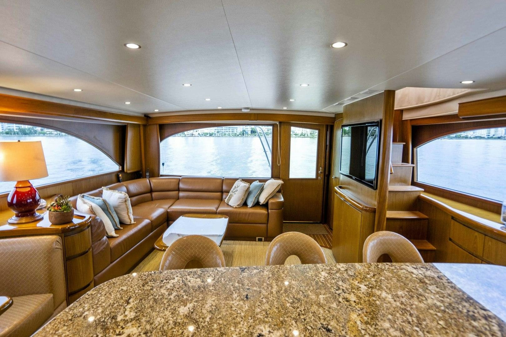 a living room with a couch and a tv aboard LAST CALL Yacht for Sale