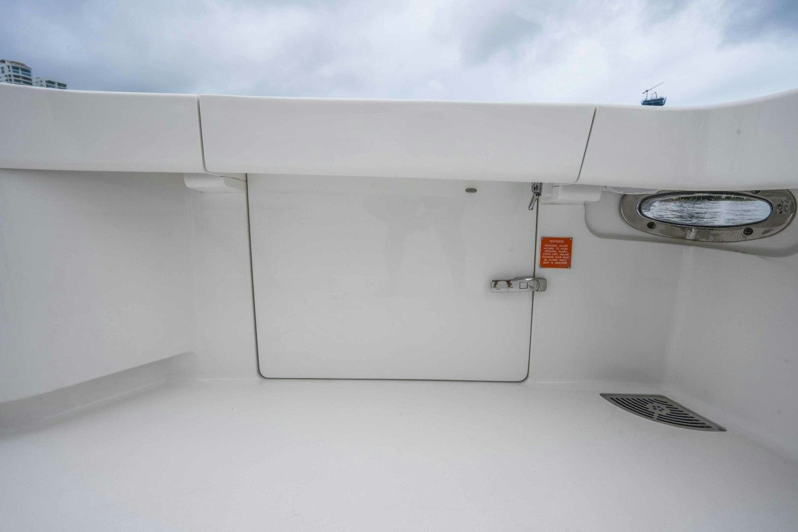 a white wall with a silver object on it aboard LAST CALL Yacht for Sale